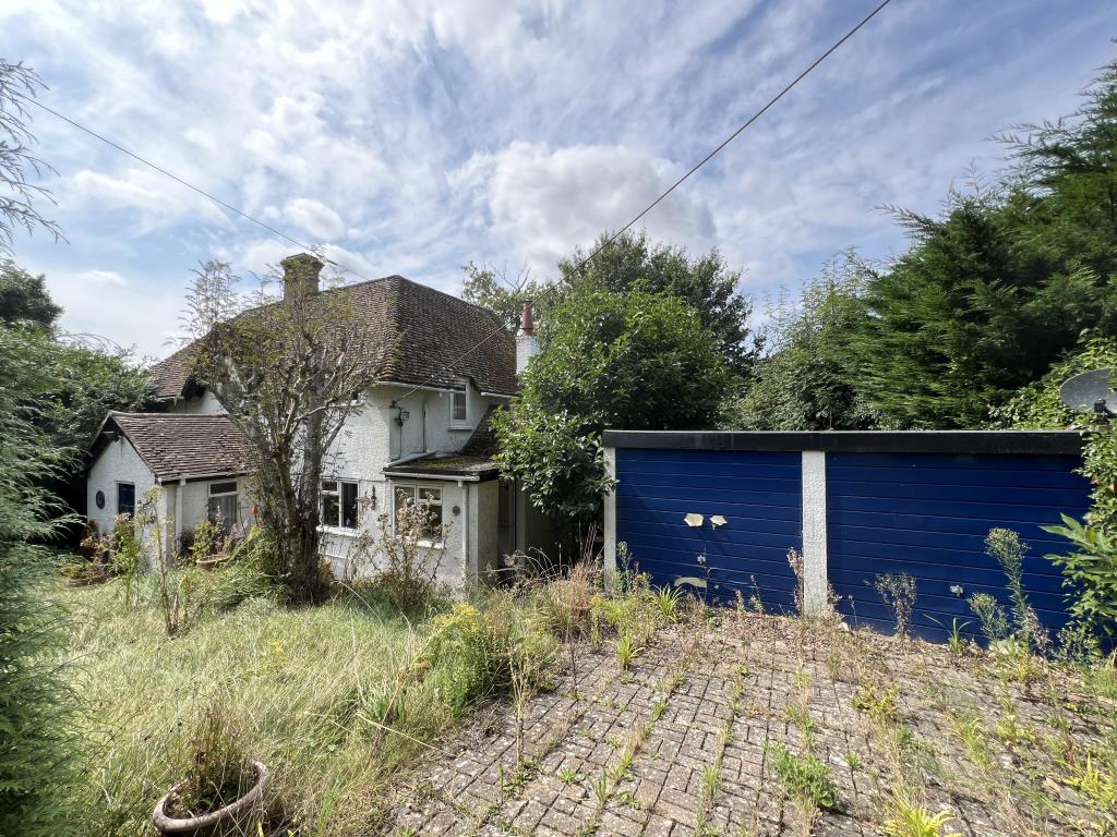 Lot: 2 - DETACHED THREE-BEDROOM HOME FOR IMPROVEMENT WITH COUNTRYSIDE VIEWS - Front showing double garage and driveway